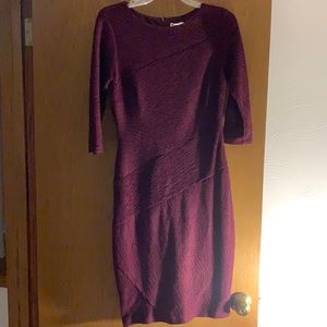 Maroon dress. Form fitting, 3/4 Sleeves.